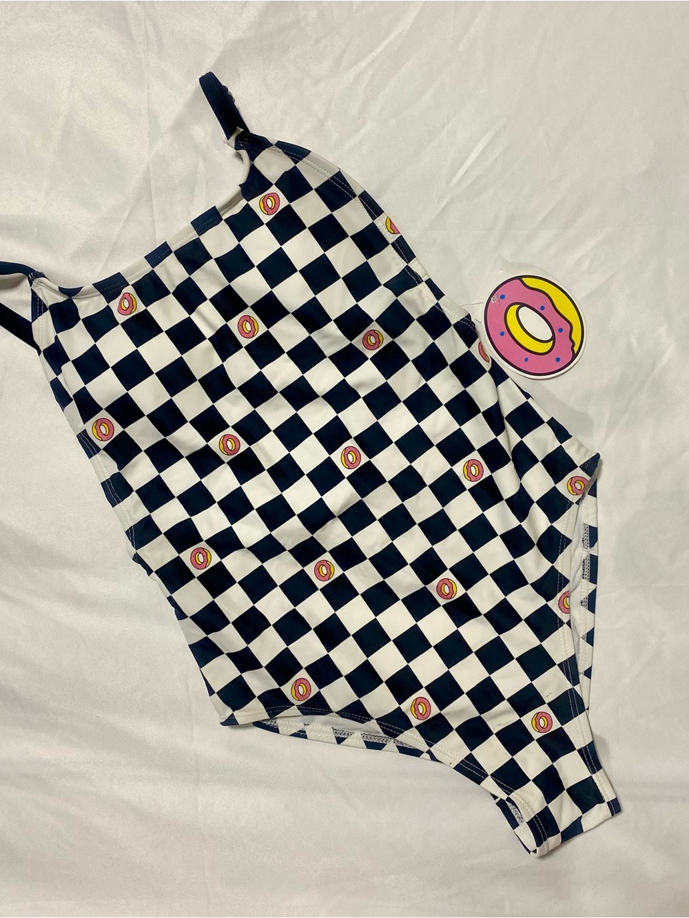 Zumiez Black & White Checkerboard One-Piece Swimsuit with Pink Donut Accents